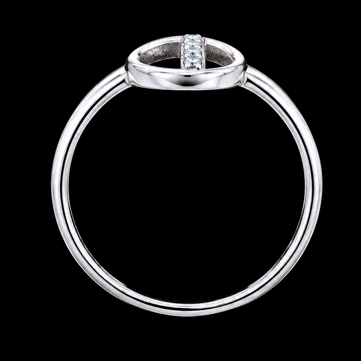 A silver ring with a row of clear cubic zirconia stones on a black background.