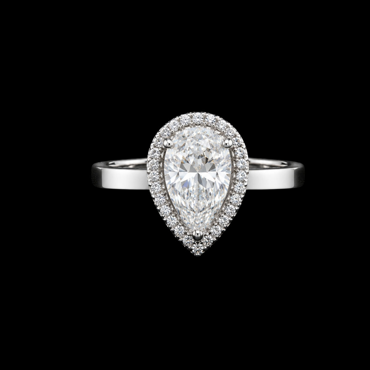 A pear-shaped CZ ring with a silver-tone band and a halo of smaller CZ stones.