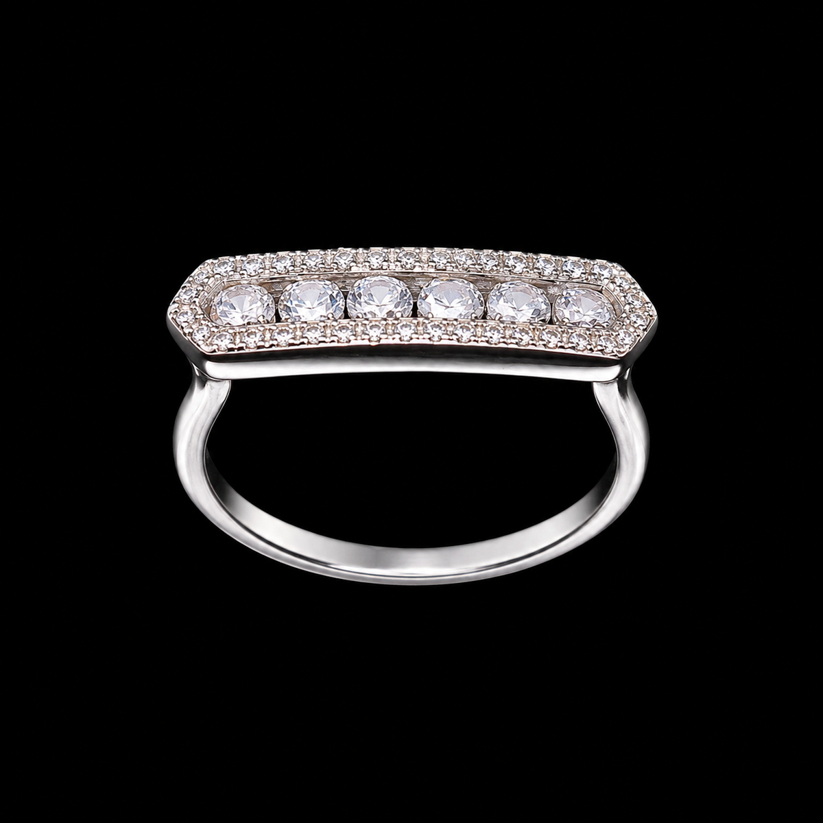 A silver ring with a row of round-cut cubic zirconia stones on a black background.