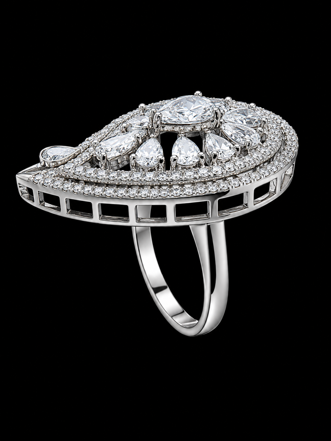 A silver-tone ring with a large round CZ stone and smaller CZ stones on a black background.