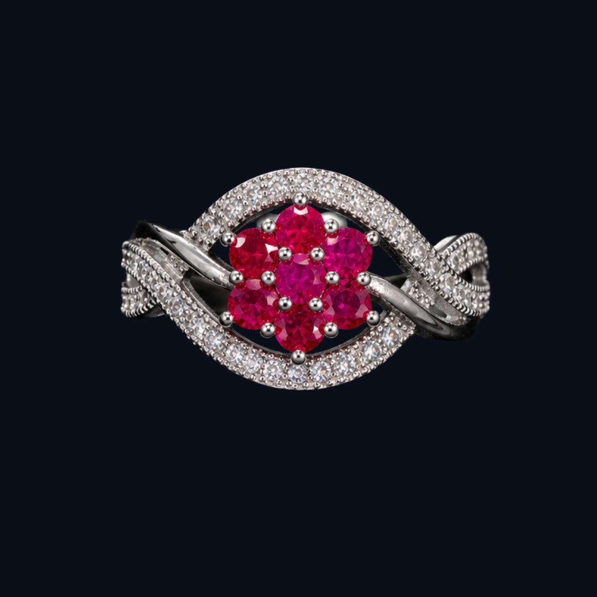 A silver-tone ring with a ruby flower design and CZ stones