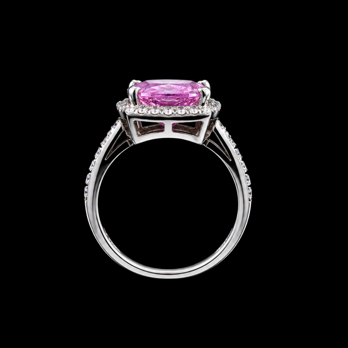 A silver ring with a pink CZ stone, set in a classic design.