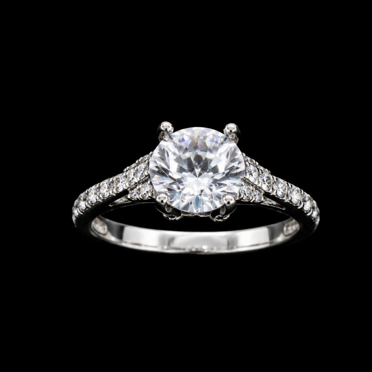 A silver-tone ring with a large round-cut CZ stone, set in a prong setting.