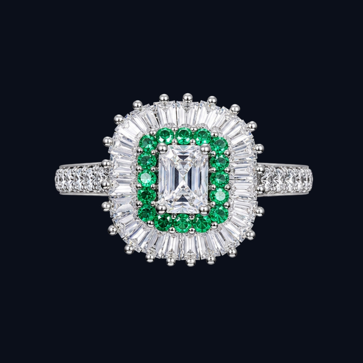 A silver ring with an emerald and diamond design.