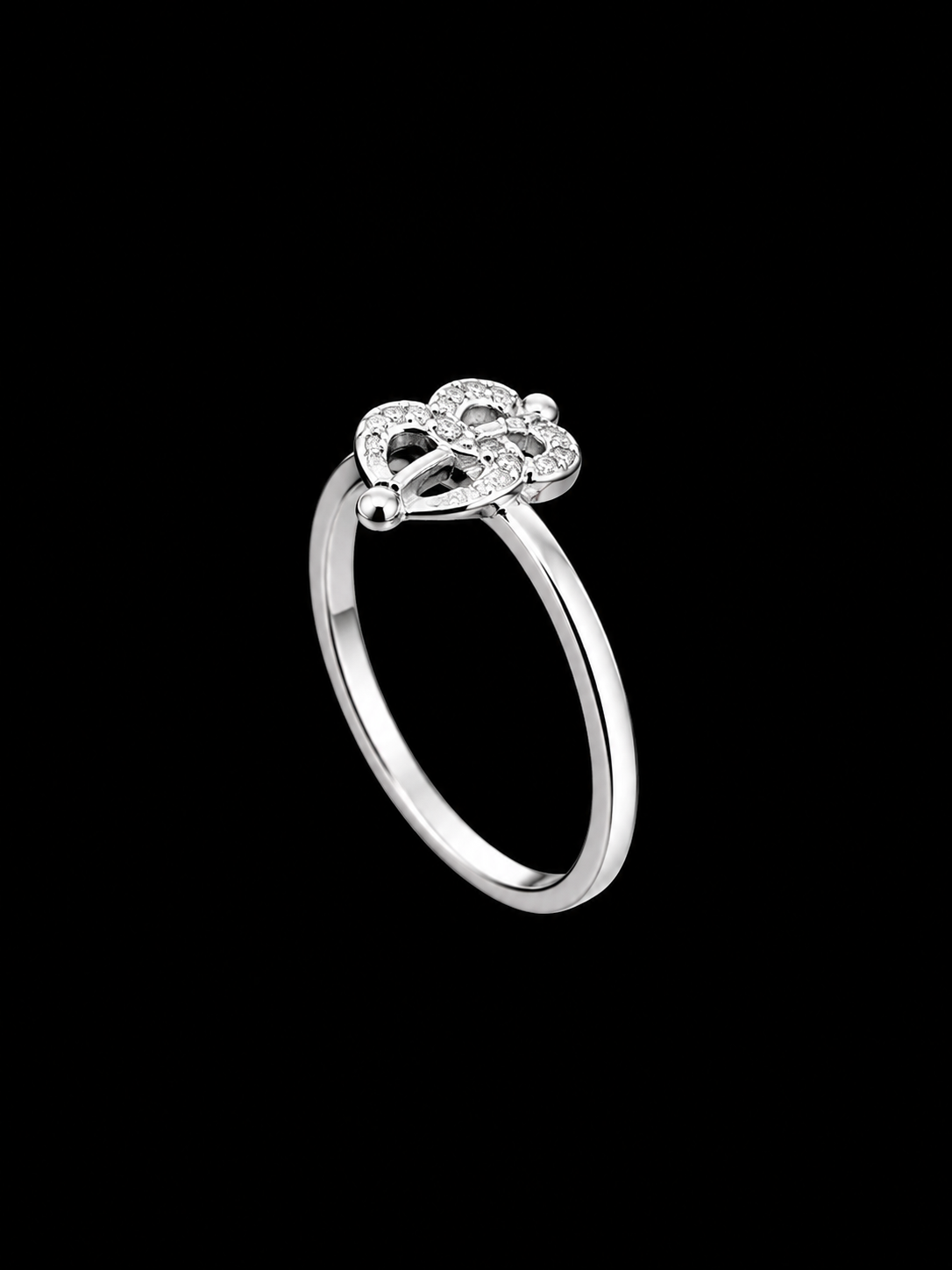 A silver tone ring with a cluster of CZ stones in a floral motif.