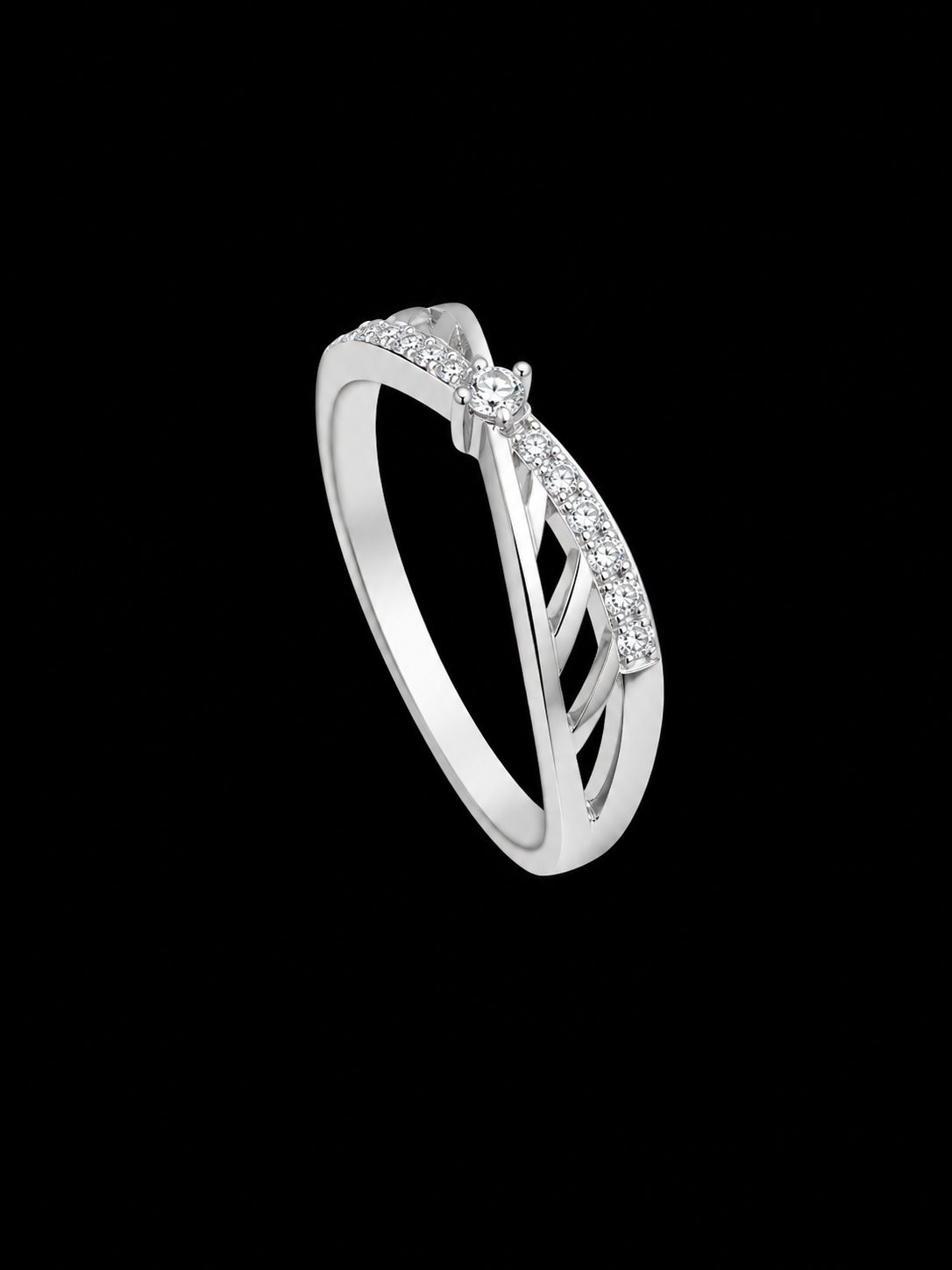 A silver-tone ring with a row of round CZ stones on a black background.