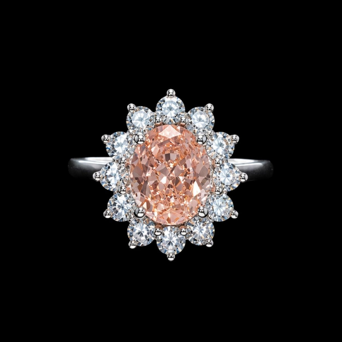 A peach-colored CZ stone ring with clear CZ accents on a silver band.