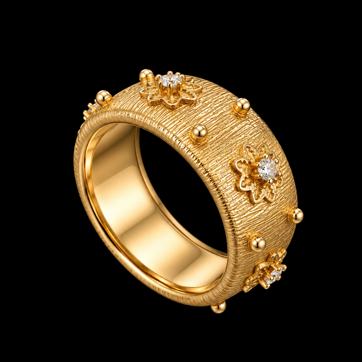 A gold-tone ring with a textured surface and CZ stones.