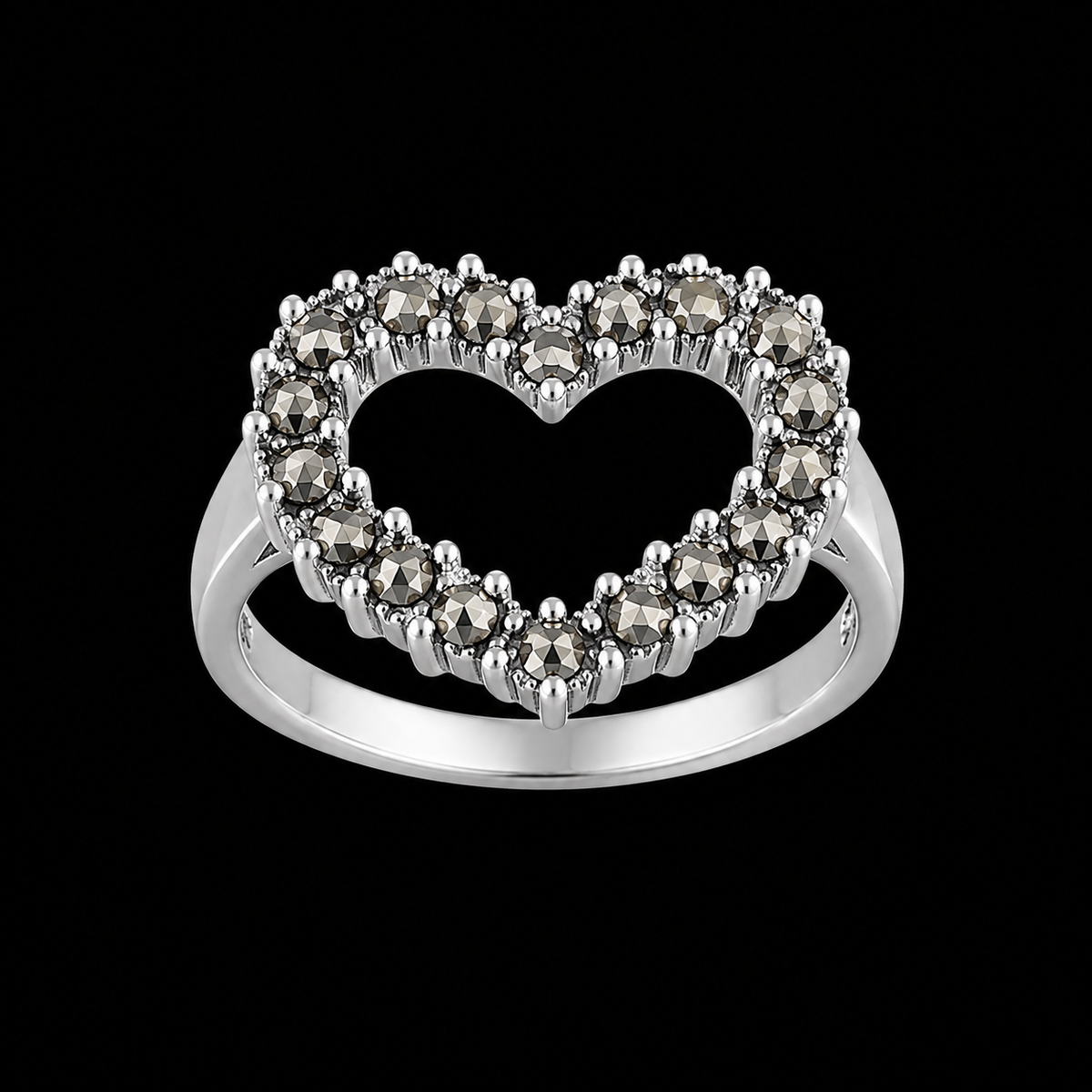 A silver ring with a heart-shaped design and CZ stones.