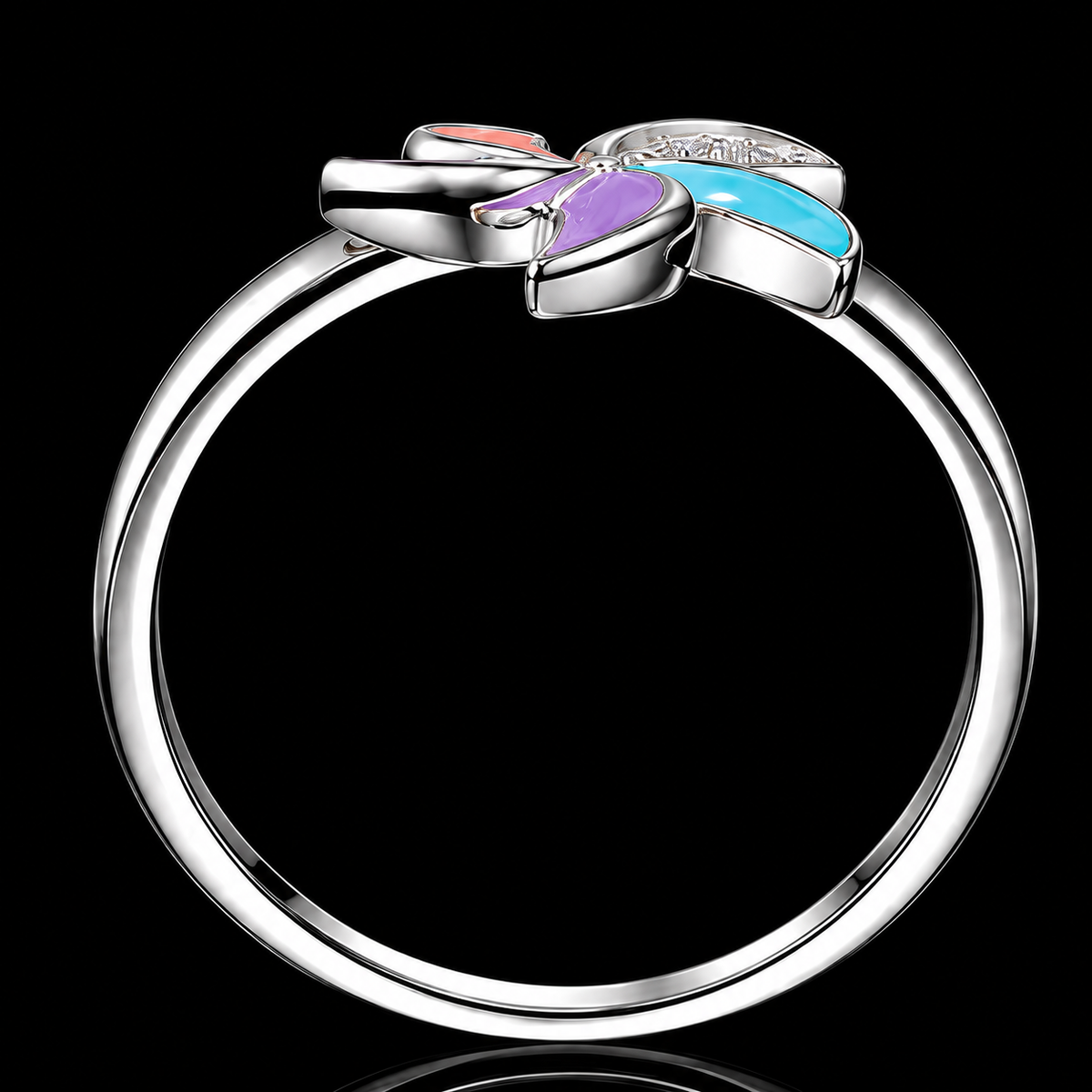 A silver ring with a colorful enamel bow design