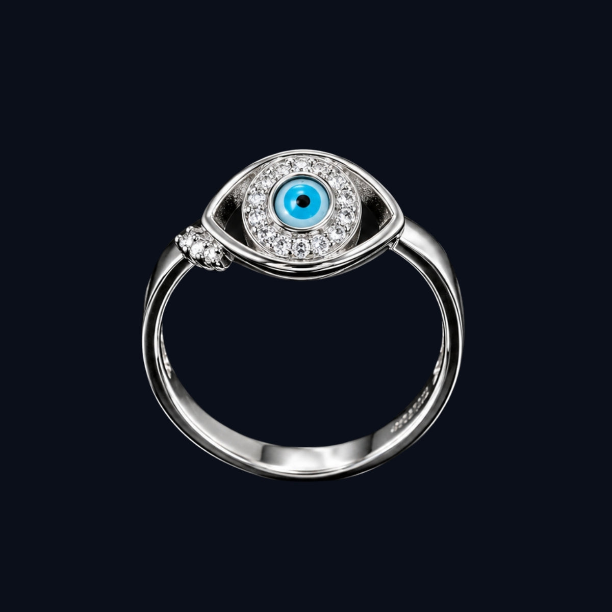 A silver-tone ring with an evil eye motif and CZ stones.