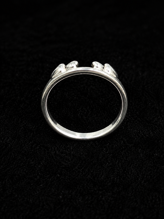 A silver-tone ring with three round-cut CZ stones set in a minimalist design.