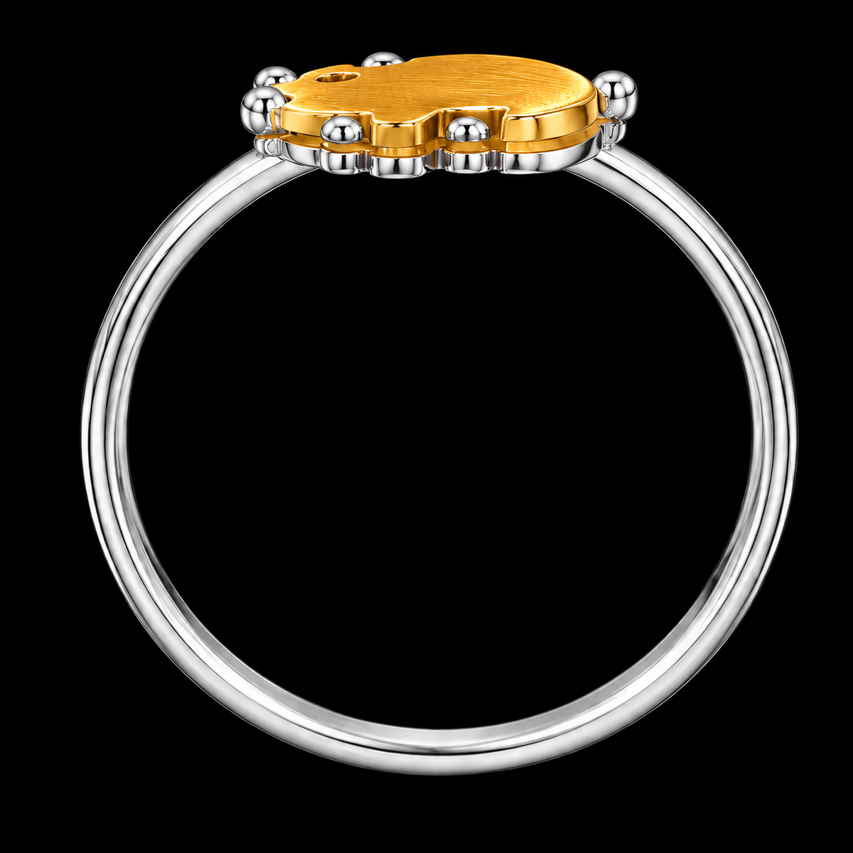 A gold-tone ring with a silver-tone band and CZ stone.