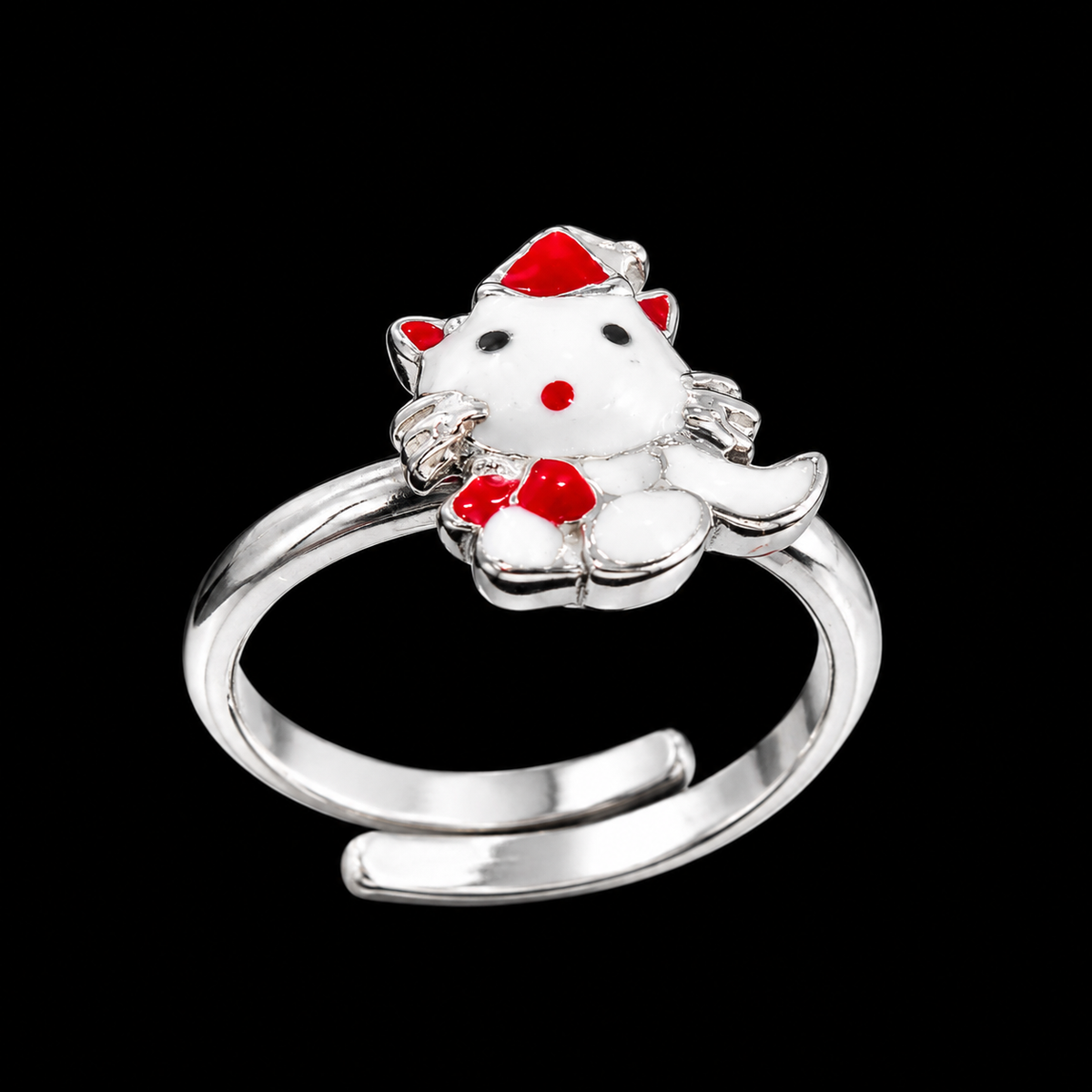 A silver ring with an enamel cat design on a black background