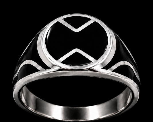 A silver ring with an enamel design on a plain background