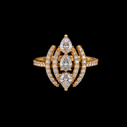 A gold ring with three marquise-cut clear CZ stones and smaller round CZ accents, set in a gold-tone metal.