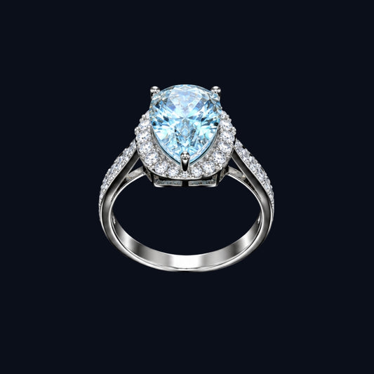 A silver ring with a large, light blue gemstone and smaller clear gemstones.