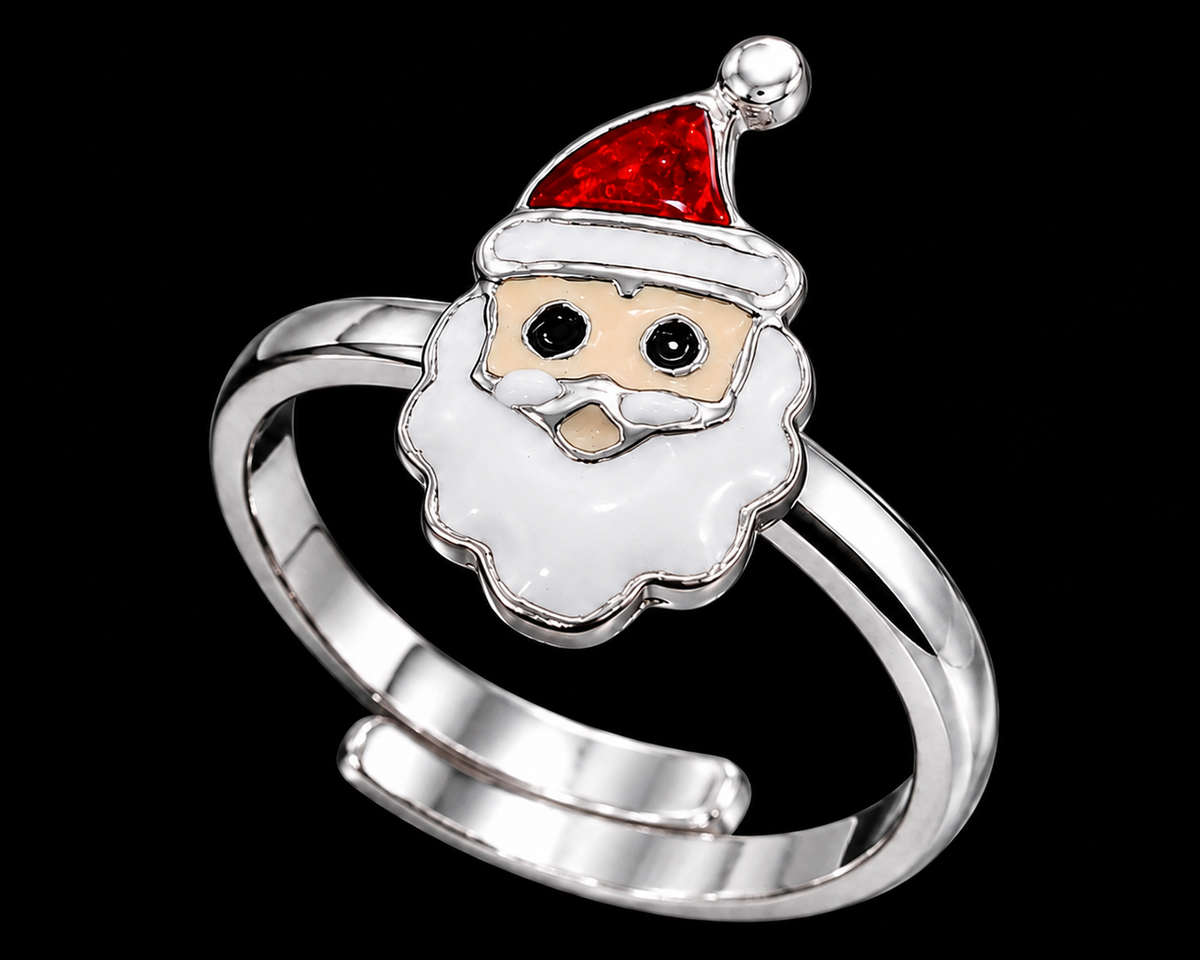 A silver ring featuring a Santa Claus design with a red hat and white beard.
