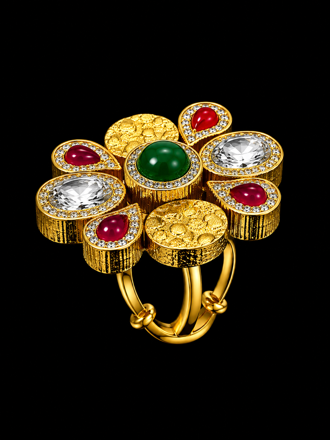 A gold-tone ring with a green center stone and red and white CZ stones.