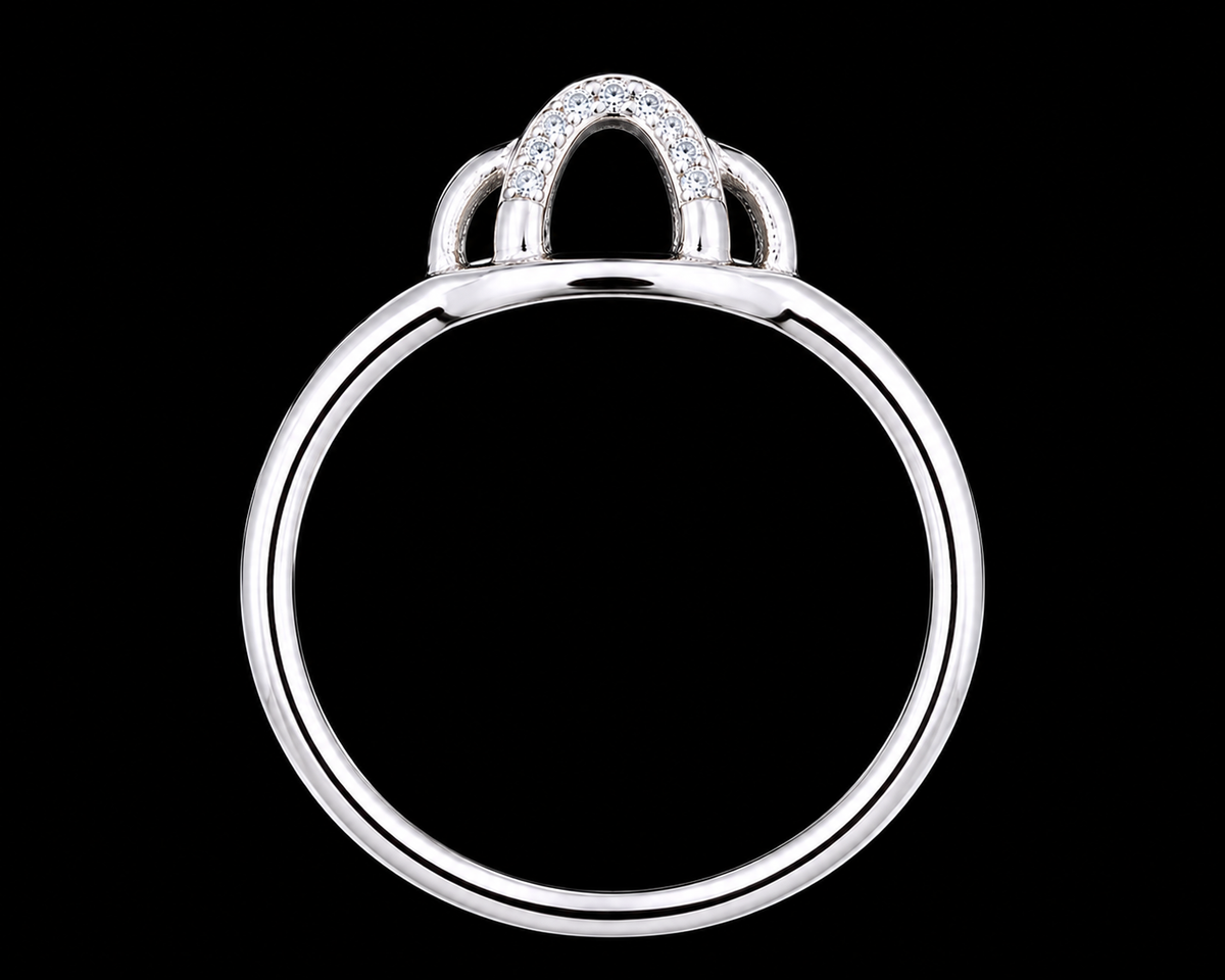 A silver ring with CZ stones on a plain background