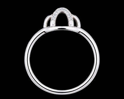 A silver ring with CZ stones on a plain background