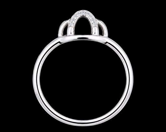 A silver ring with CZ stones on a plain background