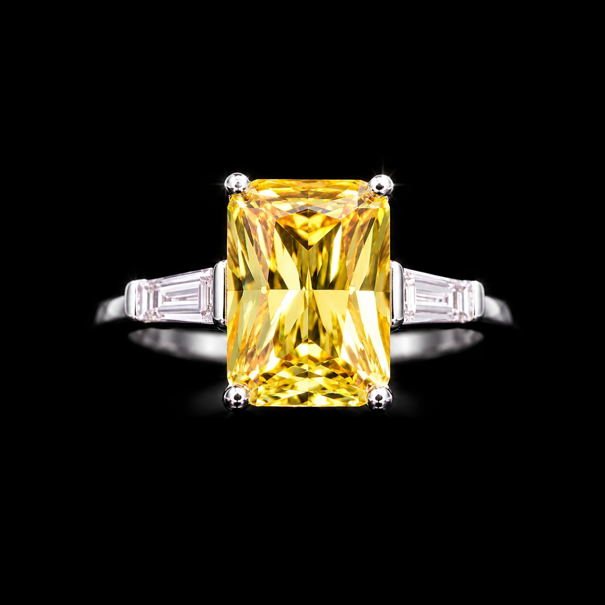 A silver ring with a large yellow CZ stone in the center, set against a black background.