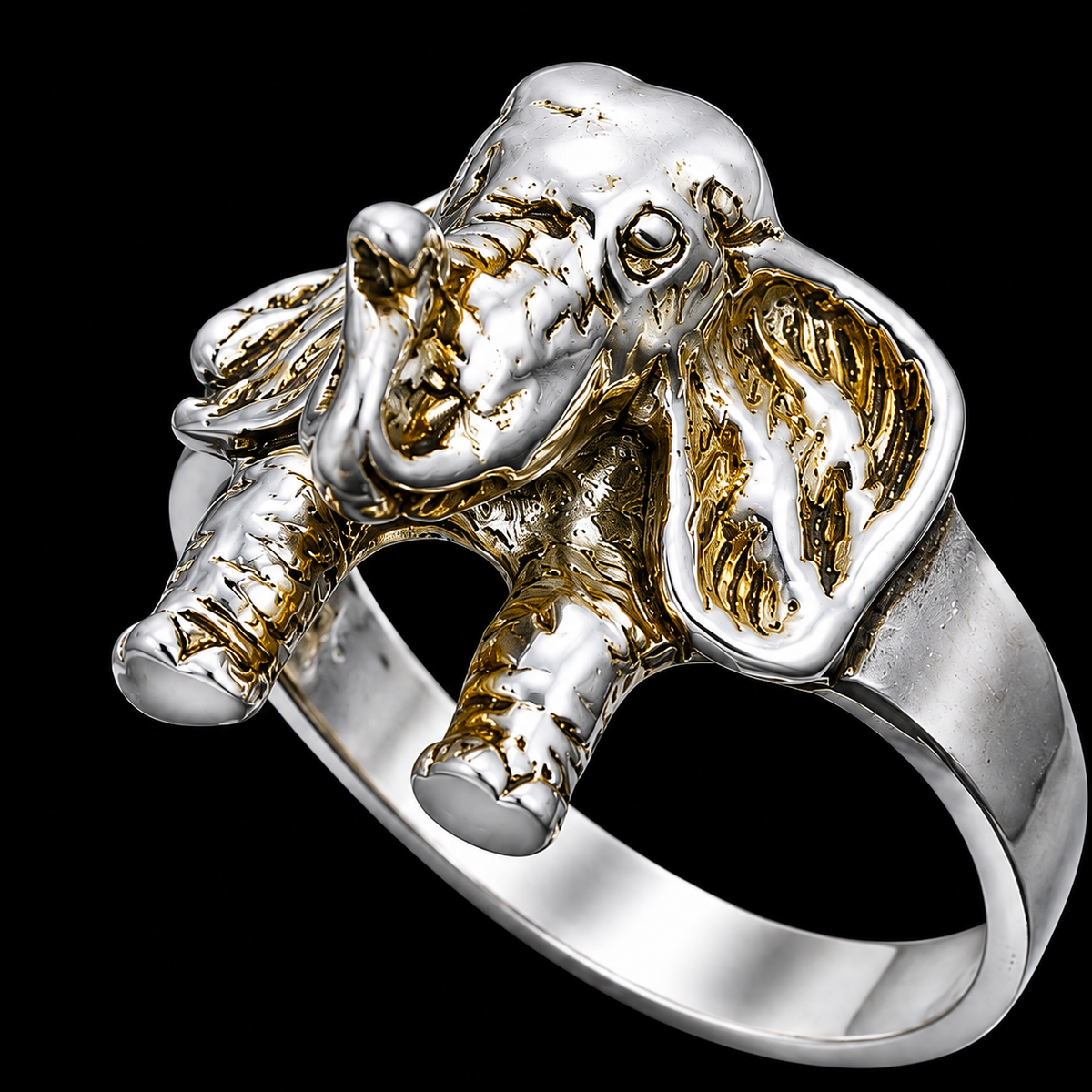 A silver ring with an elephant design and CZ stones, set against a black background.