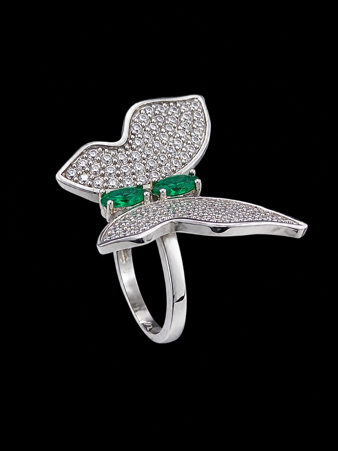 A silver-tone butterfly ring with CZ stones and green enamel accent