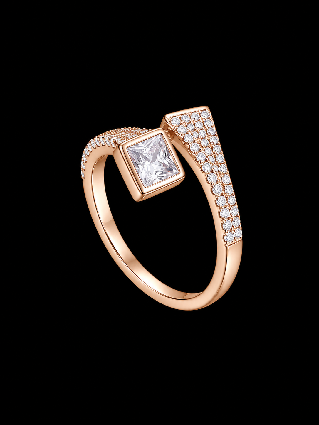 A rose gold ring with a square-cut cubic zirconia stone and smaller CZ stones on the band.