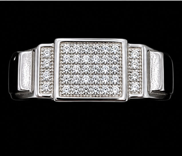 A silver ring with a square design and CZ stones.
