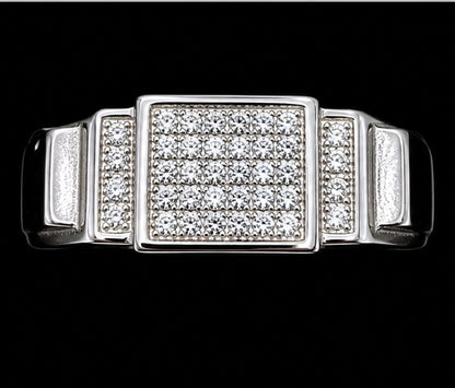 A silver ring with a square design and CZ stones.