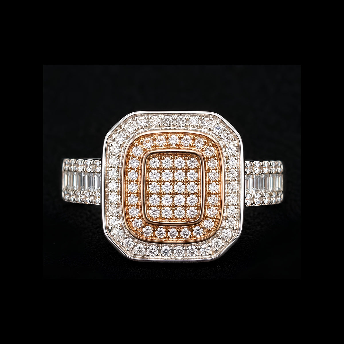 A square-shaped ring with a gold-tone and silver-tone design, featuring clear cubic zirconia stones.