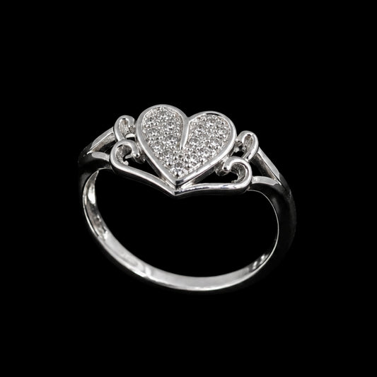 A silver-tone ring with a heart-shaped motif and clear cubic zirconia stones.