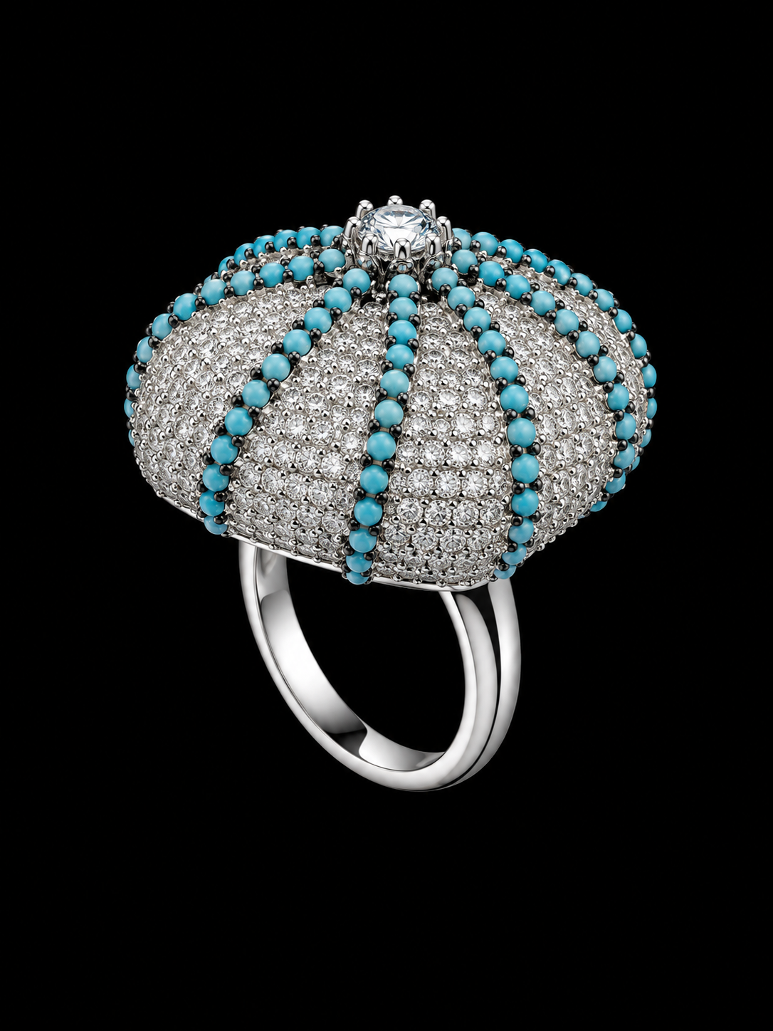 A silver tone crown ring with a central stone and CZ stones