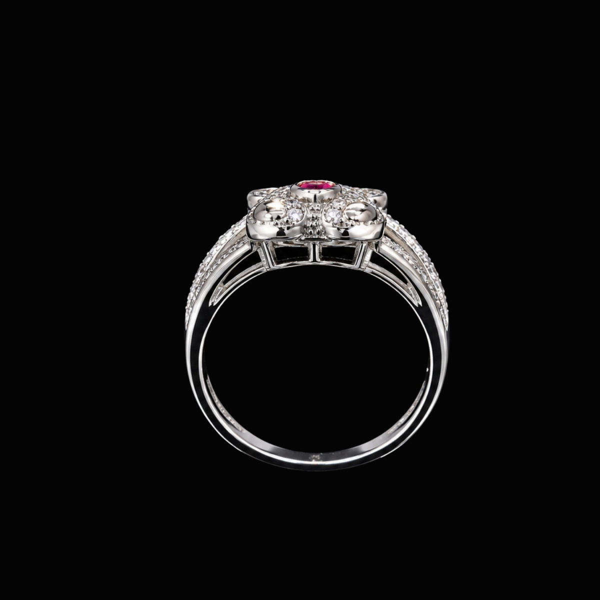 A silver-tone ring with a central CZ stone and smaller CZ stones around it.