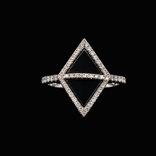 A silver ring with a black diamond and clear CZ stones