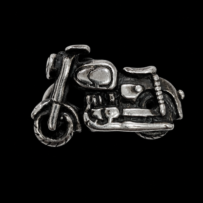 A silver ring with a detailed motorcycle design