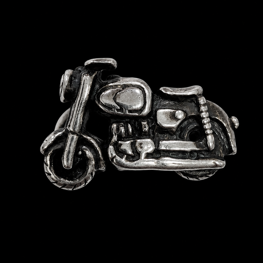 A silver ring with a detailed motorcycle design