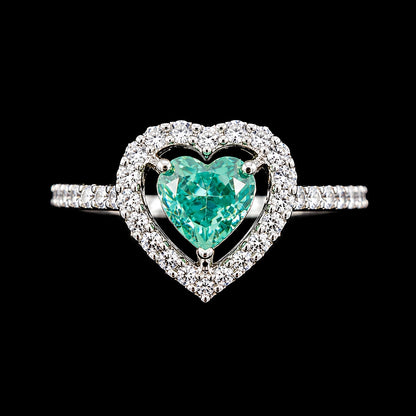 A heart-shaped ring with CZ stones and a silver-tone finish.