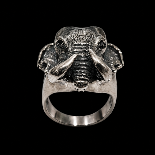 A silver ring featuring an elephant design with CZ stones.