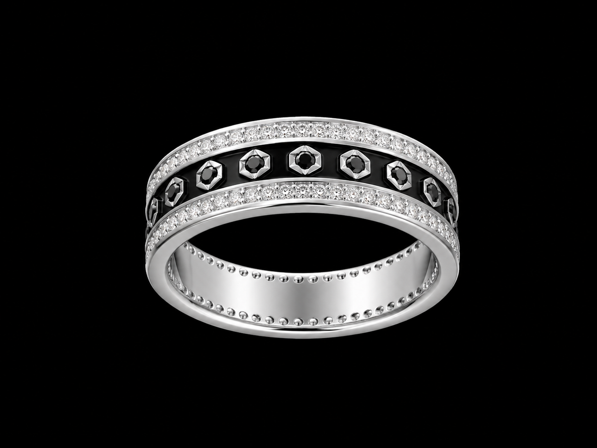 A silver ring with a row of clear cubic zirconia stones and a black enamel band with a geometric pattern of clear cubic zirconia stones.