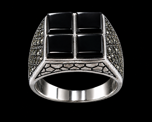 A silver-tone ring with a black cross design and black CZ stones.