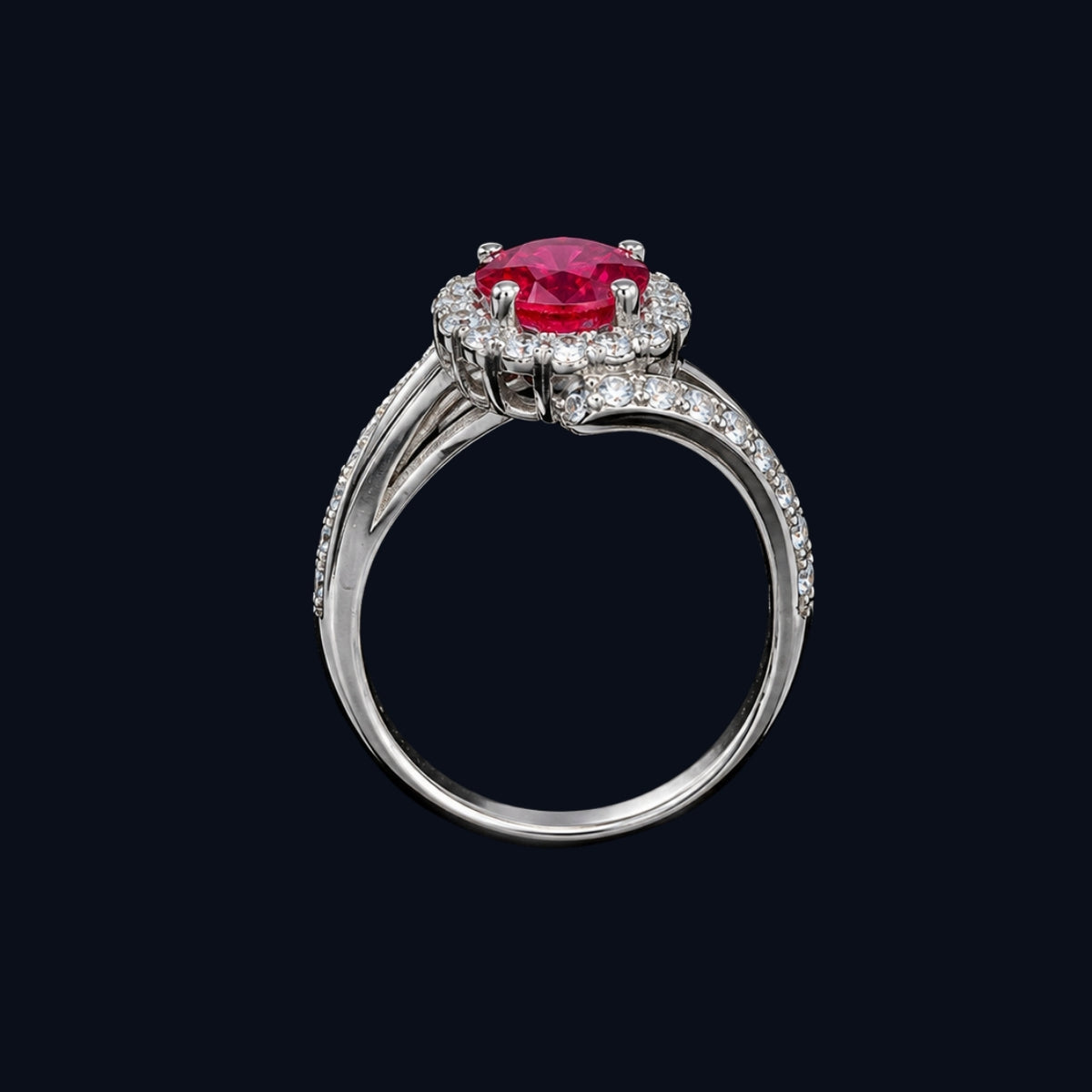A silver-tone ring with a ruby stone and CZ stones