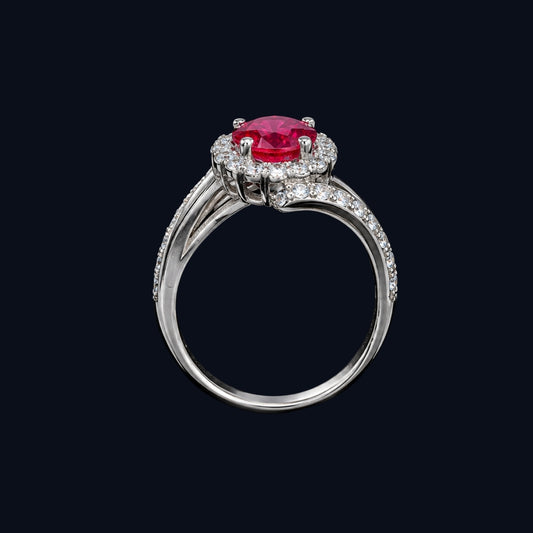 A silver-tone ring with a ruby stone and CZ stones