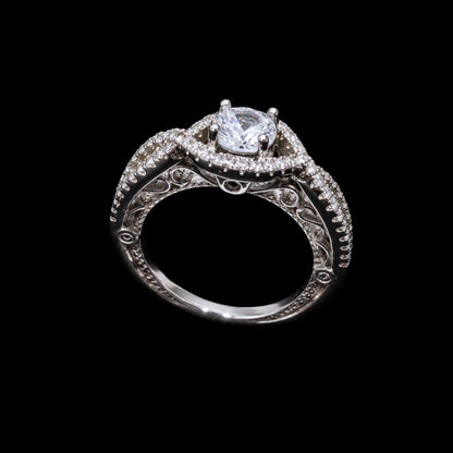 A silver ring with a CZ stone and enamel work