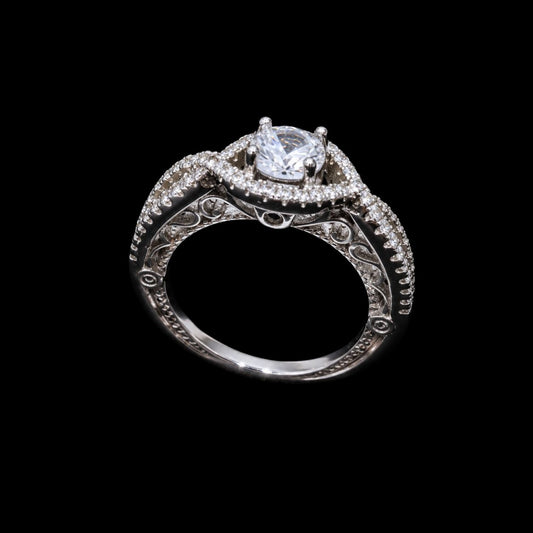 A silver ring with a CZ stone and enamel work