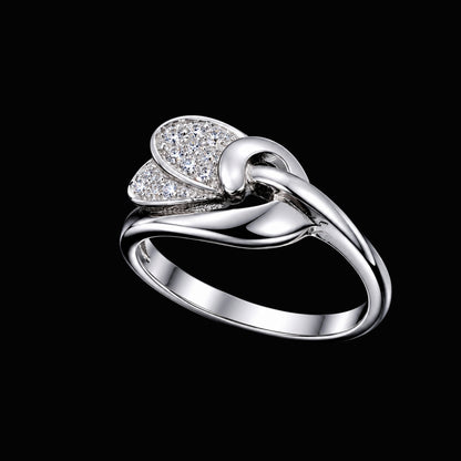 A silver ring with a knot design and clear cubic zirconia stones.
