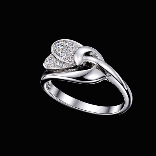 A silver ring with a knot design and clear cubic zirconia stones.