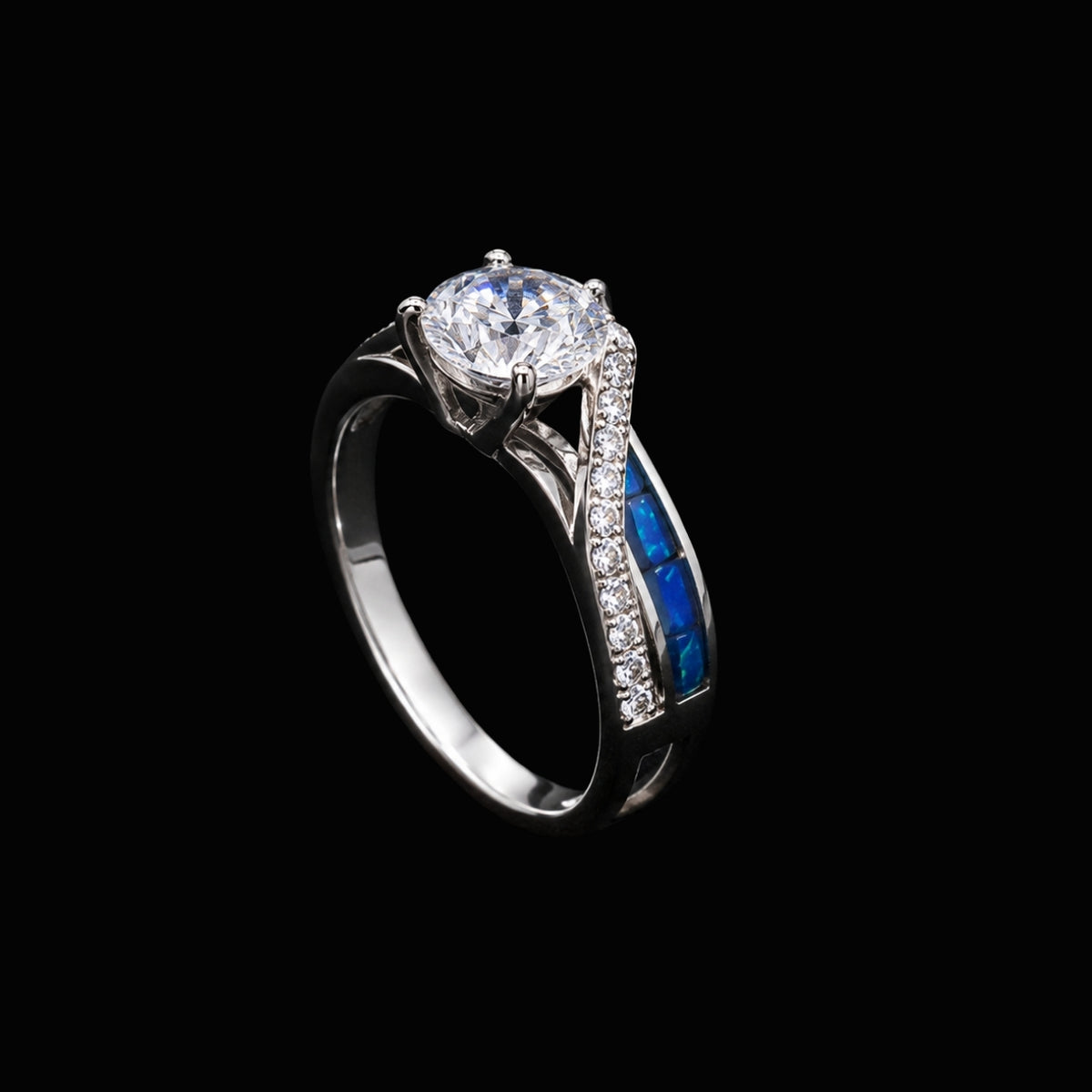 A silver ring with a large round-cut CZ stone and blue enamel accents.